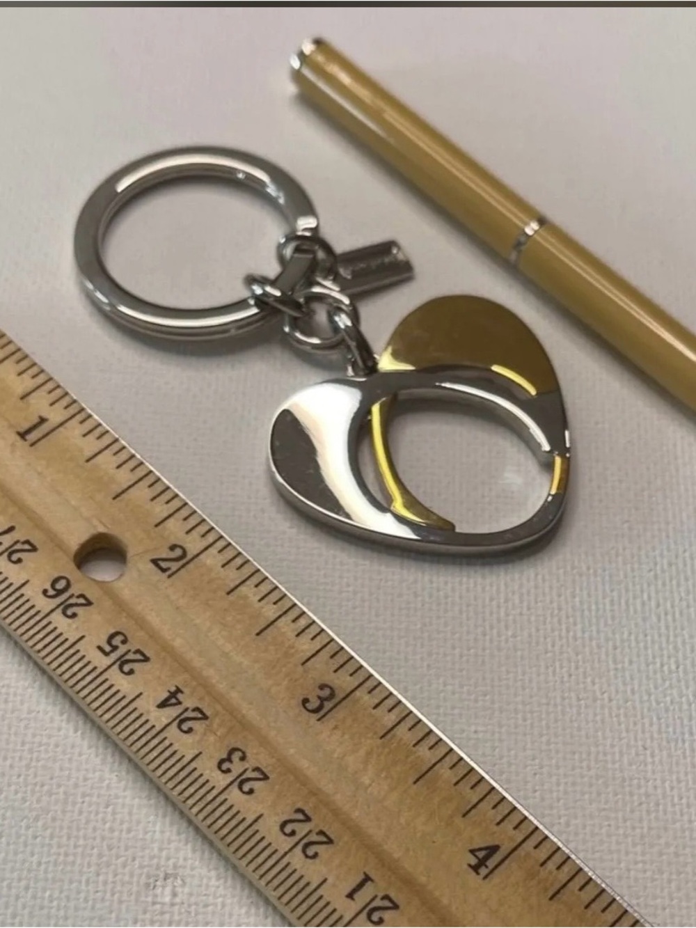Coach Silver and Gold Heart
Keychain with Cream Coach Pen NWOT - Picture 3 of 5
